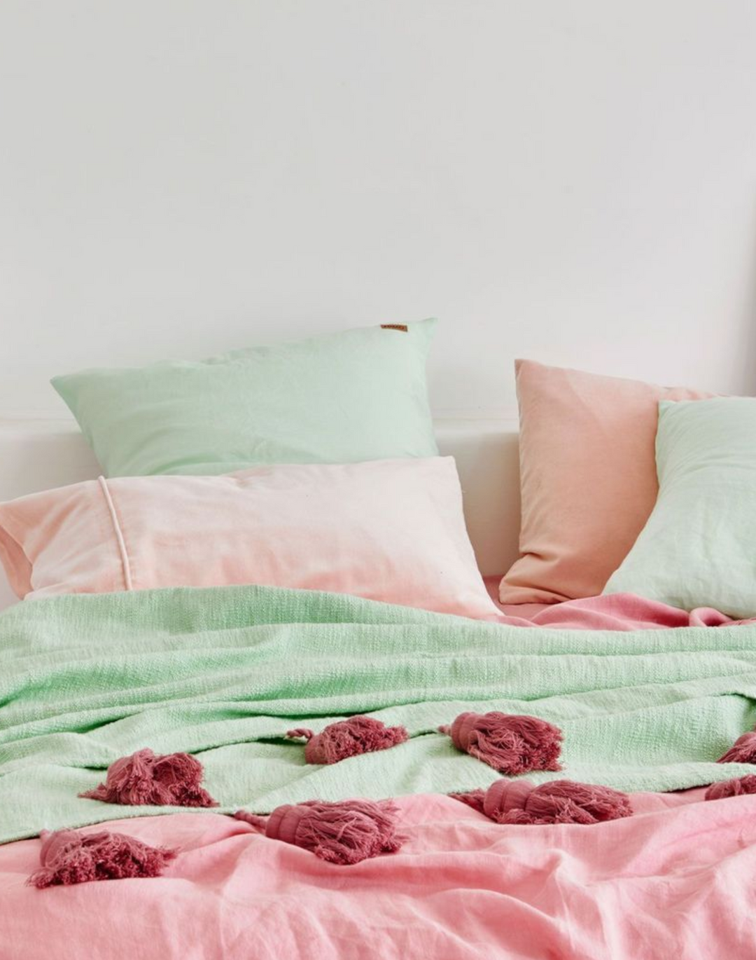Pink tassel discount throw